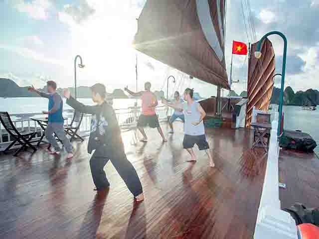 bhaya classic cruises tai chi on sundeck - Halong Bay Highlights & Travel Guide